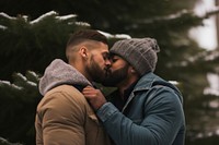 Kiss by a christmas tree photography portrait romantic. AI generated Image by rawpixel.