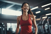 Asian woman in sportswear walking in a gym smiling adult determination. AI generated Image by rawpixel.