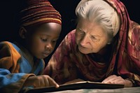 Older woman helping young american african child photography portrait reading. 