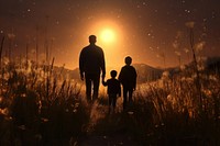 Silhouette of a family walking backlighting outdoors. 