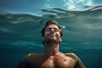 Relaxed man enjoying the sea swimming portrait outdoors. AI generated Image by rawpixel.