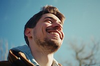 Smiling man laughs outside laughing smile adult. AI generated Image by rawpixel.