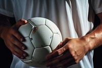 Hand holding soccer ball sports football player. AI generated Image by rawpixel.
