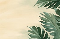 Tropical leaves border green backgrounds outdoors. 