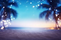 Beach with palm leaves night backgrounds defocused. 