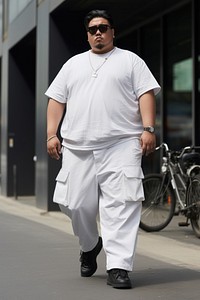Chubby young asian man standing fashion street. AI generated Image by rawpixel.