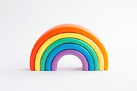 A rainbow toy white background simplicity. AI generated Image by rawpixel.