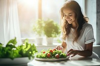 A Sporty young woman is preparing healthy food on light kitchen green restaurant vegetable. AI generated Image by rawpixel.