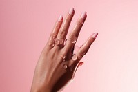 Woman back hand finger pink pink background. AI generated Image by rawpixel.