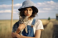 A cool woman carrying a cat photography portrait animal. AI generated Image by rawpixel.