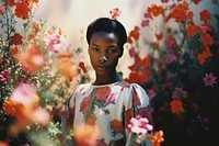 An african girl in the flower garden photography portrait outdoors. AI generated Image by rawpixel.