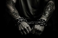 Criminal in handcuffs tattoo black protection. AI generated Image by rawpixel.