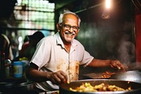 Indian elderly cooking south asian food glasses adult. 