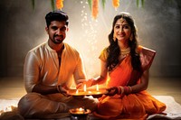 An indian couple getting marry togetherness spirituality cross-legged. AI generated Image by rawpixel.