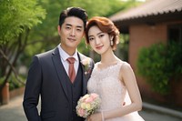 Chinese couple in wedding outdoors fashion dress. 