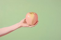 A hand holding apple painting adult plant. AI generated Image by rawpixel.
