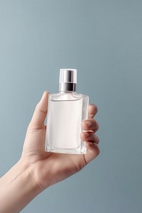 Perfume bottle with lable cosmetics holding hand. AI generated Image by rawpixel.