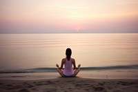 Woman meditating beach outdoors horizon. AI generated Image by rawpixel.