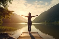 Woman stretching arms lake outdoors nature. AI generated Image by rawpixel.