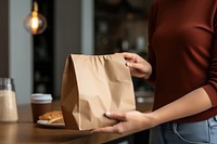 Recieving from delivery man bag holding adult. AI generated Image by rawpixel.