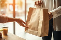 Recieving from delivery man bag holding handbag. AI generated Image by rawpixel.