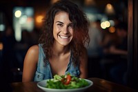 Woman eating a dish of salad portrait smile plate. AI generated Image by rawpixel.