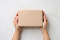 Hand holding deliverly box cardboard accessories accessory. AI generated Image by rawpixel.