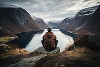 Norewegian man sitting landscape mountain. AI generated Image by rawpixel.