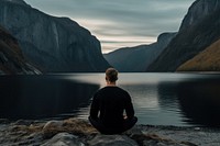 Norewegian man sitting landscape outdoors. AI generated Image by rawpixel.