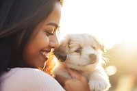 Hispanic young woman playing with a puppy photography portrait mammal. AI generated Image by rawpixel.