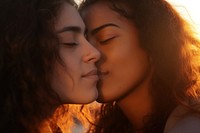 Hispanic portrait of two lesbian women kissing on sunset photography adult affectionate. AI generated Image by rawpixel.