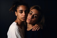 Two Latinix lesbian women hugging each other and looking on the camera photography portrait adult. AI generated Image by rawpixel.