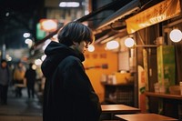 Young handsome Taiwanese man enjoying local street food contemplation architecture illuminated. AI generated Image by rawpixel.