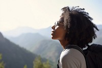Black young woman enjoying view from outlook during hike in mountains portrait outdoors travel. AI generated Image by rawpixel.