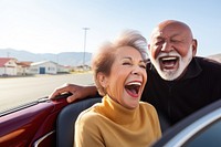 Latinx Older couple laughing in convertible adult togetherness architecture. AI generated Image by rawpixel.