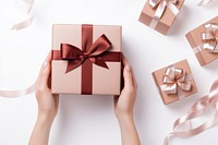 Makeup cosmetics and gift box in hand celebration anniversary decoration. AI generated Image by rawpixel.
