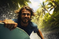 Muscular surfer rides in tropical paradise photography portrait outdoors. AI generated Image by rawpixel.