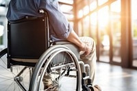 Paraplegic patient sitting in wheelchair receiving care bicycle transportation architecture. AI generated Image by rawpixel.