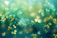 Clover leaf pattern bokeh effect background backgrounds abstract outdoors. AI generated Image by rawpixel.