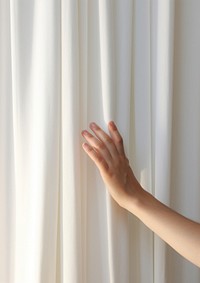 Hand opening a white curtain on stage finger backgrounds barefoot. 