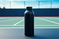 Black thermos bottle blue tennis court exercising. AI generated Image by rawpixel.