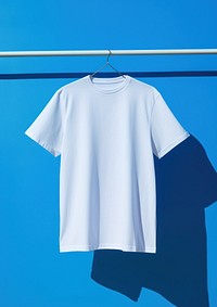 Hanging t-shirt sleeve blue coathanger. AI generated Image by rawpixel.