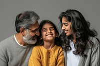 Indian family laughing looking glasses. 