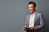 Mixed race asian businessman laughing smiling looking. AI generated Image by rawpixel.