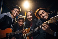 Filipino teenage friends entertainment musician guitar. AI generated Image by rawpixel.