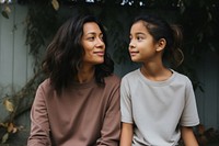 Mother and daughter looking adult contemplation. AI generated Image by rawpixel.