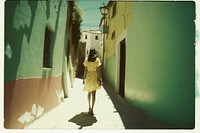 Woman walking alley photography. AI generated Image by rawpixel.