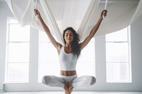 Indian woman doing fly yoga stretching room exercise fitness. AI generated Image by rawpixel.