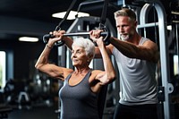Senior woman doing lat pulldowns exercise gym sports adult. AI generated Image by rawpixel.