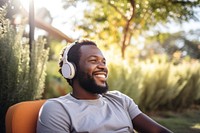 Man headphones headset smiling. AI generated Image by rawpixel.